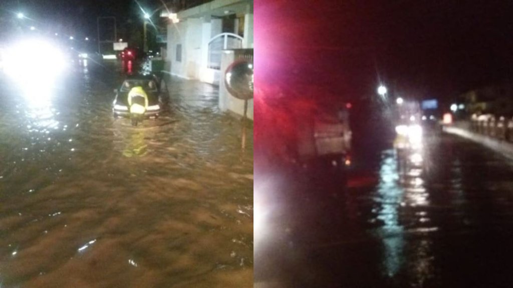 بالصور/ الدفاع المدني يسحب سيارتين في بشمزين - الكورة بعدما علقتا بسبب تجمع مياه الأمطار