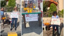 مجموعة من الشباب الأردنيين يبيعون عصير برتقال لجمع المساعدات لأطفال وأهالي الضحايا في لبنان