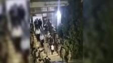 بالفيديو/ لحظة خروج القاضية عون من أمام شركة مكتّف بمواكبة عناصر الجيش
