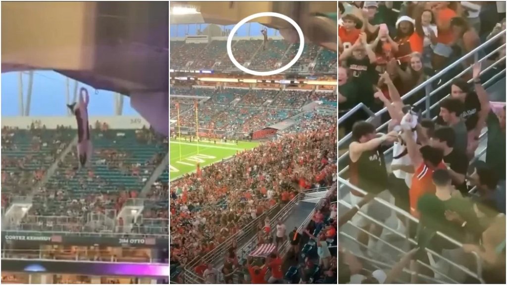 بالفيديو/ لحظات تحبس الأنفاس لإنقاذ قطة تدلّت على منصة ملعب كرة القدم وسط خشية مئات المشجعين!