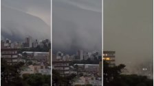 بالفيديو/ غيمة داكنة ضخمة معروفة باسم سحابة الرف تظهر في سماء مدينة برازيلية وتحجب الرؤية عن البنايات