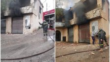 الدفاع المدني أخمد النيران التي اندلعت داخل محلين في رب ثلاثين اثر القصف الإسرائيلي